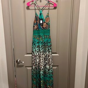 Different shades of green mixed with orange/neutral tones. Maxi dress/with slit